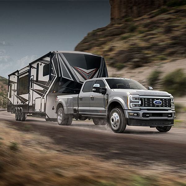 Ford Super Duty in motion towing an RV