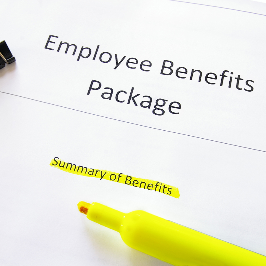 Employee Benifits Package paperowrk with a yellow highlighter