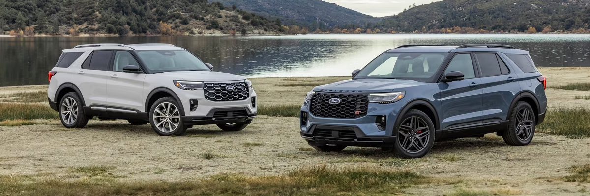 Two 2025 Ford Explorer® models parked on a beach