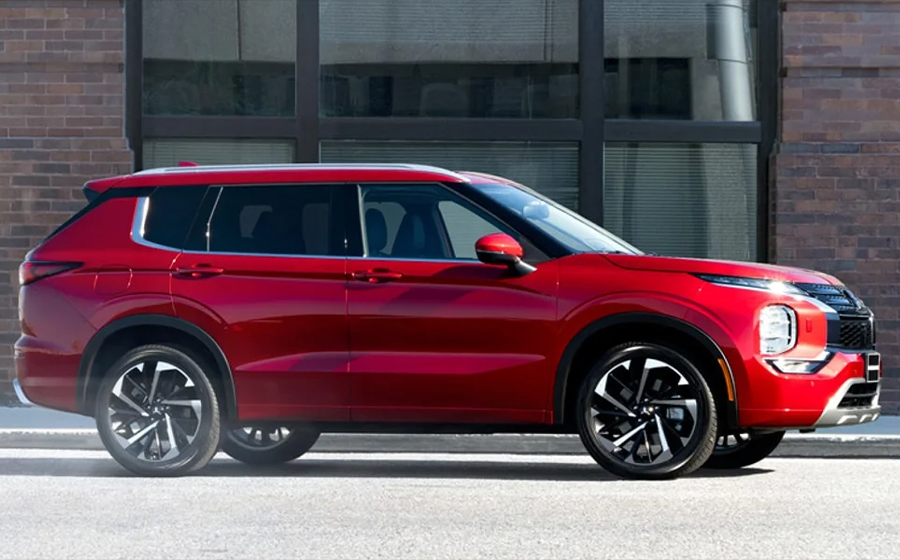 Side profile view of a red 2024 Mitsubishi Outlander